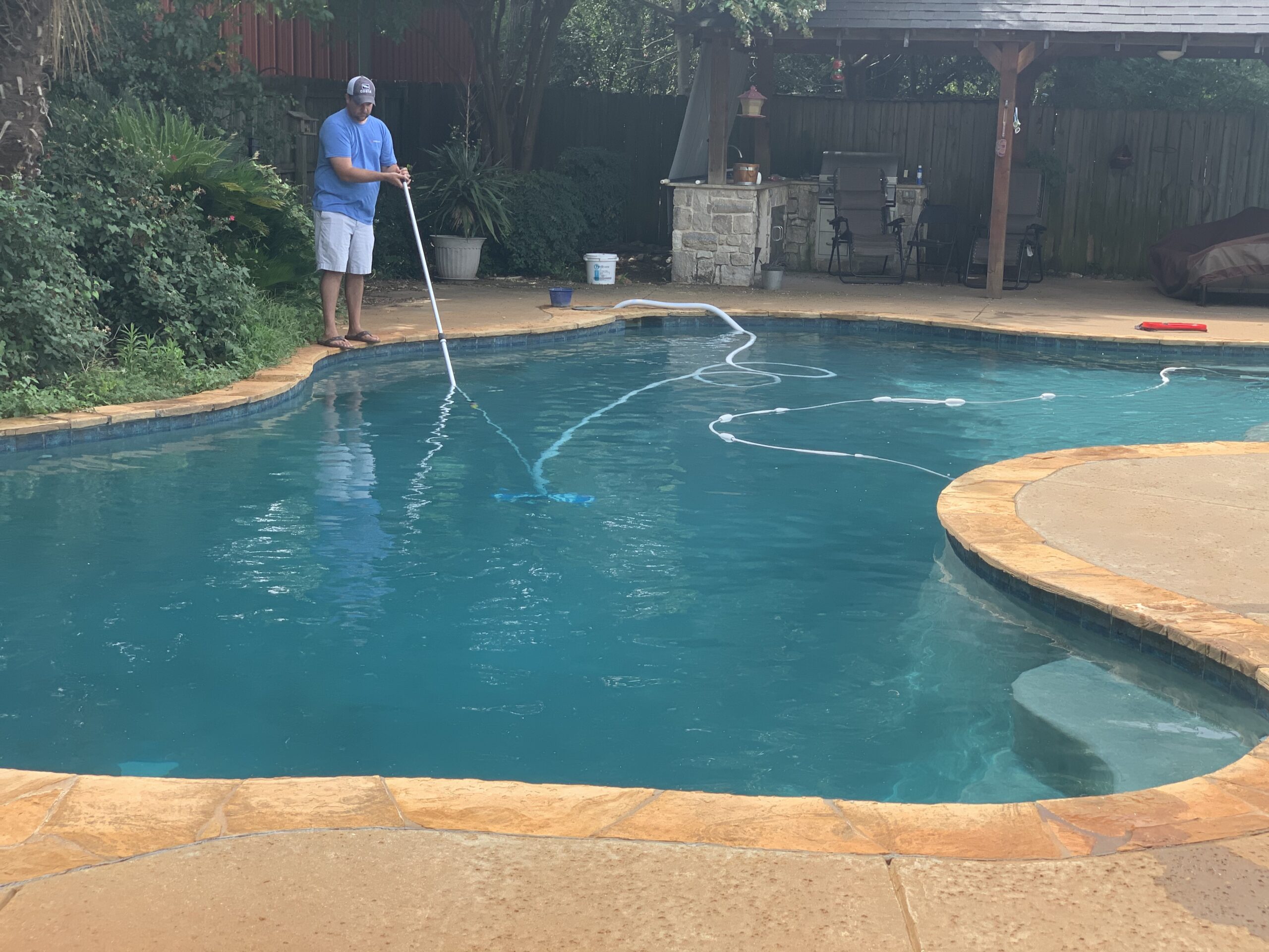 Same residential swimming pool with clear blue water during professional recovery